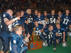 Picture of the 2003 Reitz Panthers with the West Side Nut Club Trophy after their 24-14 win
